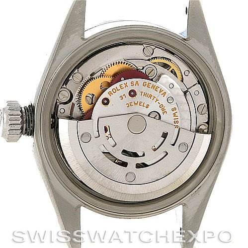 The image shows the back view of the Rolex Date 79160 Women
s Stainless Steel White Dial 79160 Women
s Stainless Steel White Dial model watch, highlighting its movement mechanism.