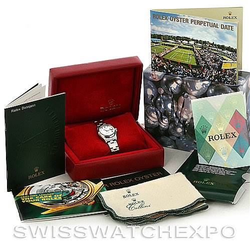 The image shows a Rolex Date 79160 Women
s Stainless Steel White Dial 79160 Women
s Stainless Steel White Dial model watch in its original box, with booklets, a cleaning cloth, and other packaging accessories.