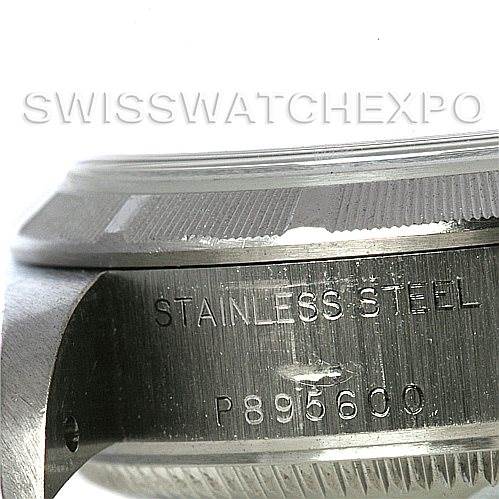 The image shows a close-up view of the side of a Rolex Date 79190 Women's Stainless Steel Black Dial 79190 Women's Stainless Steel Black Dial model watch, highlighting the stainless steel material and serial number.