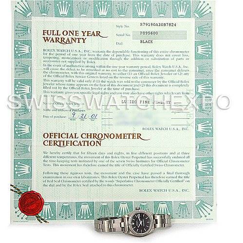 The image shows a Rolex Date 79190 Women's Stainless Steel Black Dial 79190 Women's Stainless Steel Black Dial model watch and its warranty certificate from a top-down angle.