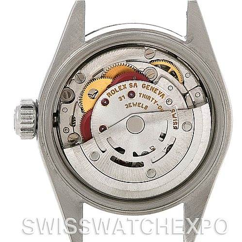 This image shows the internal mechanism of a Rolex Date 79160 Women's Stainless Steel Black Dial 79160 Women's Stainless Steel Black Dial model watch from a rear view, displaying the intricate gears and movement.