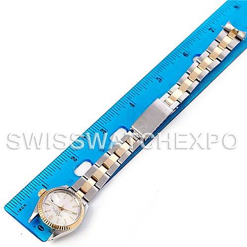 The image shows a Rolex Date 6917 Women's Stainless Steel Silver Dial 6917 Women's Stainless Steel Silver Dial model watch lying flat next to a blue ruler, displaying both the dial and full bracelet.