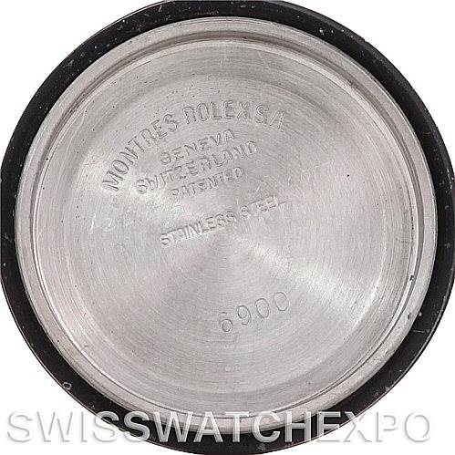 This image shows the interior of a Rolex Date 6917 Women's Stainless Steel Silver Dial 6917 Women's Stainless Steel Silver Dial watch back cover, highlighting the engravings: "Montres Rolex S.A., Geneva, Switzerland, Patented, Stainless Steel, 6900."