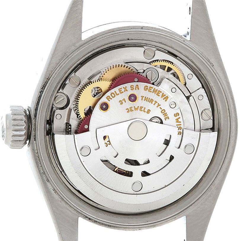 The image shows the internal mechanics and movement of a Rolex Date 79160 Women's Stainless Steel Blue Dial 79160 Women's Stainless Steel Blue Dial model watch, including gears and the rotor, viewed from the back.