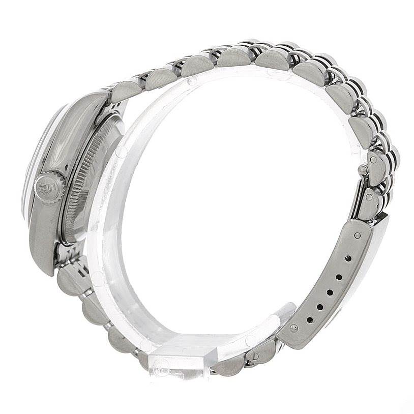 The image shows a side angle of a Rolex Date 79160 Women's Stainless Steel Blue Dial 79160 Women's Stainless Steel Blue Dial model watch, highlighting the watch case, crown, and the bracelet with a clasp.