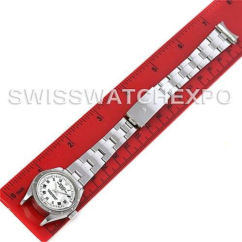 This image shows a Rolex Date 79190 Women's Stainless Steel White Dial 79190 Women's Stainless Steel White Dial model watch laid flat against a red ruler, displaying the entire strap and watch face.