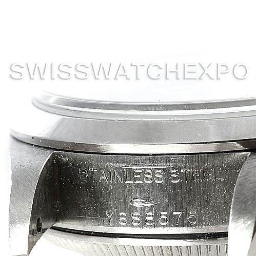 This image shows a close-up of the case side of a Rolex Date 79160 Women's Stainless Steel Blue Dial 79160 Women's Stainless Steel Blue Dial model watch, featuring the serial number and "STAINLESS STEEL" engraving.