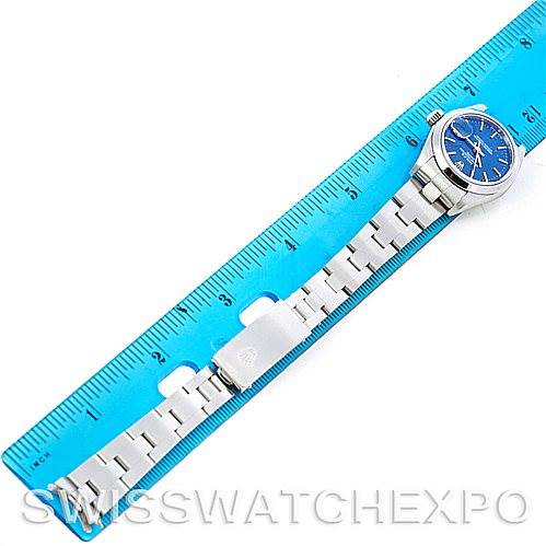 The image shows a top-down view of a Rolex Date 79160 Women's Stainless Steel Blue Dial 79160 Women's Stainless Steel Blue Dial model watch with a blue dial and silver bracelet, next to a blue ruler for scale.