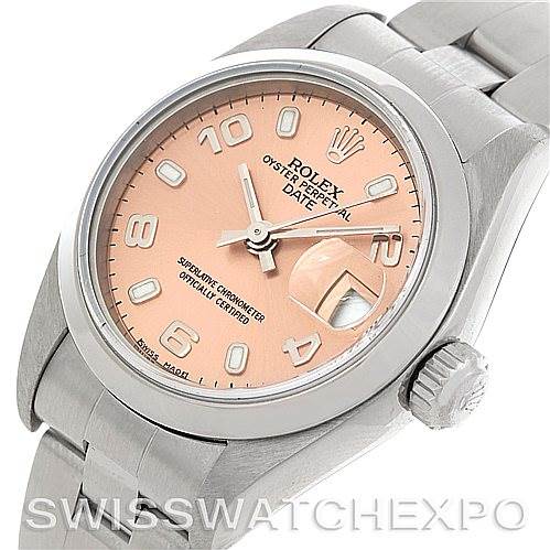 The image shows a close-up of a Rolex Date 79160 Women's Stainless Steel Pink Dial 79160 Women's Stainless Steel Pink Dial model watch, featuring its pink dial, crown, and part of its metal bracelet.