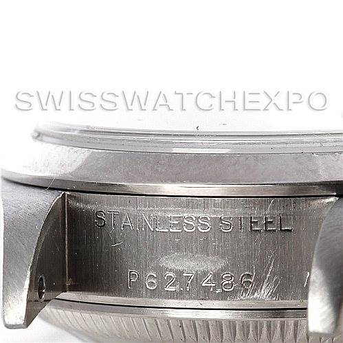 The image shows a close-up of the side view of a Rolex Date 79160 Women's Stainless Steel Pink Dial 79160 Women's Stainless Steel Pink Dial watch, focusing on the case and serial number engraving.