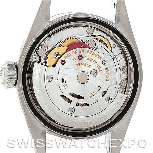 This image shows the inner mechanism of a Rolex Date 79160 Women's Stainless Steel Pink Dial 79160 Women's Stainless Steel Pink Dial watch, focusing on the movement and rotor.