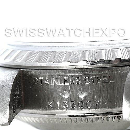 Close-up of the case side of a Rolex Date 79240 Women's Stainless Steel Silver Dial 79240 Women's Stainless Steel Silver Dial model showing the stainless steel material and serial number engraving.