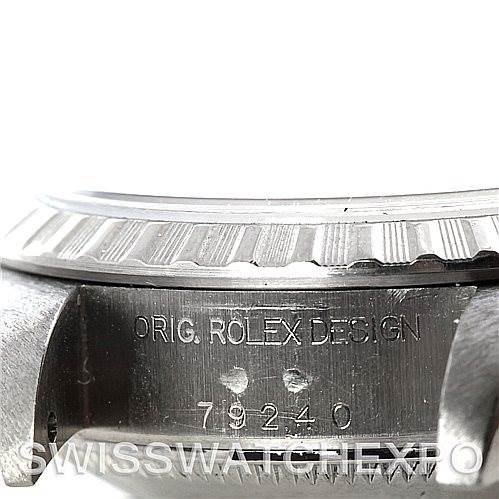 This image shows a close-up of the side of the case and bezel of a Rolex Date 79240 Women's Stainless Steel Silver Dial 79240 Women's Stainless Steel Silver Dial model, with the model number and "ORIG. ROLEX DESIGN" inscription.