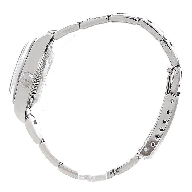 The image shows a side angle of the Rolex Date 69160 Women's Stainless Steel White Dial 69160 Women's Stainless Steel White Dial model watch, featuring its crown, bezel, and bracelet.