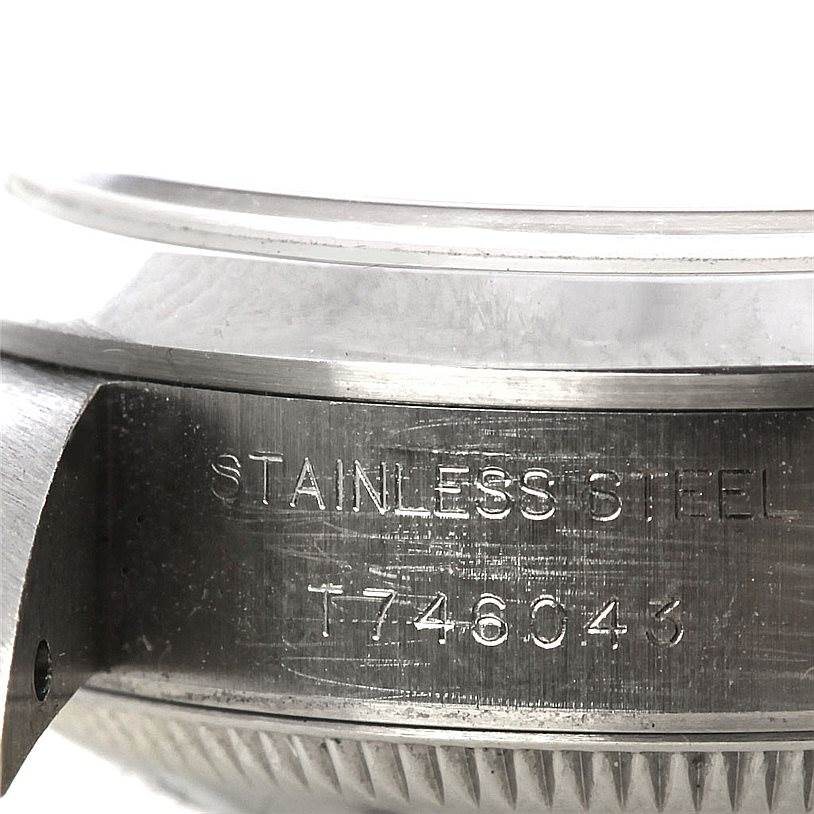 This image shows a close-up of the case side and serial number engraving on a Rolex Date 69160 Women's Stainless Steel White Dial 69160 Women's Stainless Steel White Dial model watch.