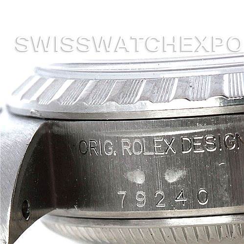 This image shows a close-up of the side of a Rolex Date 79240 Women's Stainless Steel White Dial 79240 Women's Stainless Steel White Dial model watch, focusing on the case and engravings.
