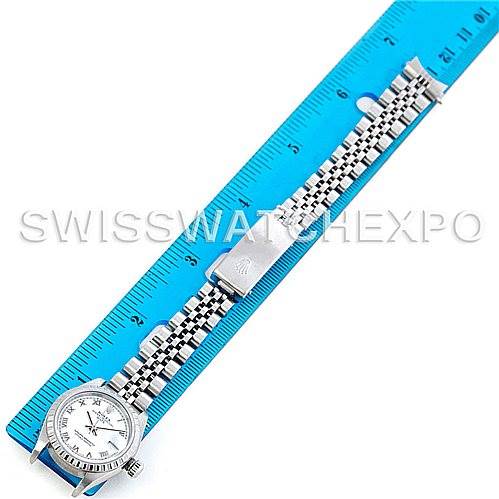 The image shows a Rolex Date 79240 Women's Stainless Steel White Dial 79240 Women's Stainless Steel White Dial model watch laid flat beside a blue ruler, displaying the face and bracelet.