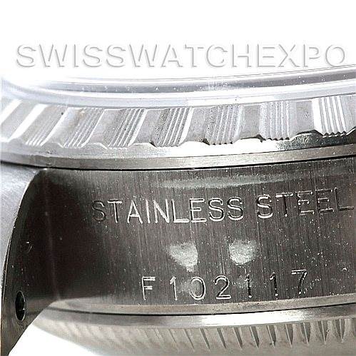 This image shows a close-up of the stainless steel case side, bezel, and part of the serial number on a Rolex Date 79240 Women's Stainless Steel White Dial 79240 Women's Stainless Steel White Dial model watch.