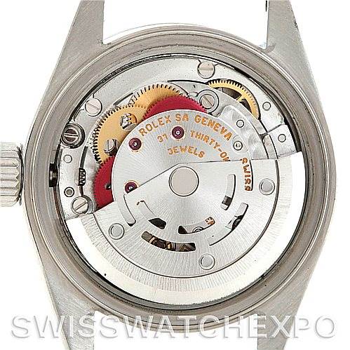 This image shows the case back removed from a Rolex Date 79240 Women's Stainless Steel Pink Dial 79240 Women's Stainless Steel Pink Dial model watch, revealing its movement and internal components.