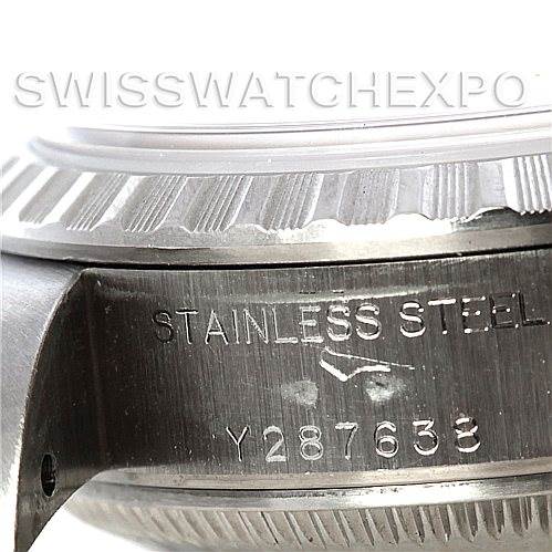 This image shows a close-up angle of the side of the case and the bezel of a Rolex Date 79240 Women's Stainless Steel Pink Dial 79240 Women's Stainless Steel Pink Dial model, highlighting the stainless steel material and serial number.
