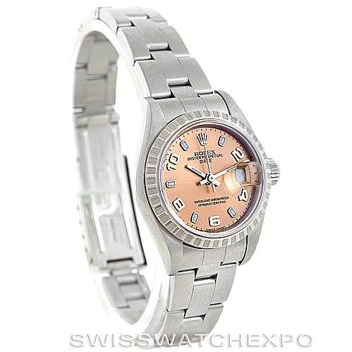 The image shows a side view angle of a Rolex Date 79240 Women's Stainless Steel Pink Dial 79240 Women's Stainless Steel Pink Dial model watch, displaying its face, bezel, and partially open metal bracelet.