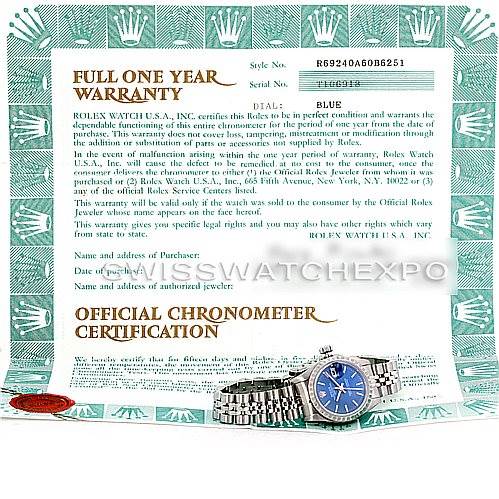 The image shows a Rolex Date 69240 Women's Stainless Steel Blue Dial 69240 Women's Stainless Steel Blue Dial watch with a blue dial and bracelet, positioned in front of its official warranty and chronometer certification papers.