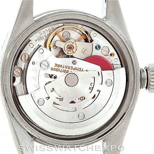 This image shows the inner workings of a Rolex Date 69240 Women's Stainless Steel Blue Dial 69240 Women's Stainless Steel Blue Dial model watch from a direct top-down angle, focusing on the movement mechanism.