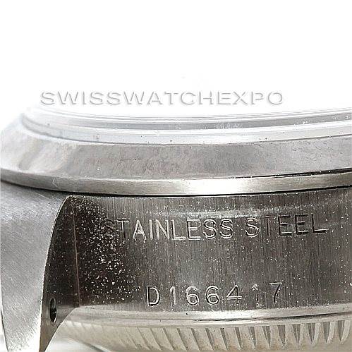 This image shows a side view of the case of a Rolex Date 79160 Women's Stainless Steel Pink Dial 79160 Women's Stainless Steel Pink Dial model, highlighting its stainless steel material and serial number.