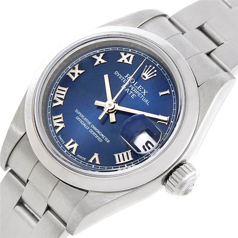 This image shows a close-up of the face, crown, and bracelet of a Rolex Date 79240 Women's Stainless Steel Blue Dial 79240 Women's Stainless Steel Blue Dial model watch from an angled view.