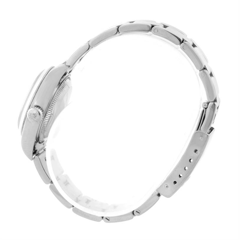 This image shows a side profile of the Rolex Date 79160 Women's Stainless Steel Beige Dial 79160 Women's Stainless Steel Beige Dial model watch, focusing on the crown and bracelet.