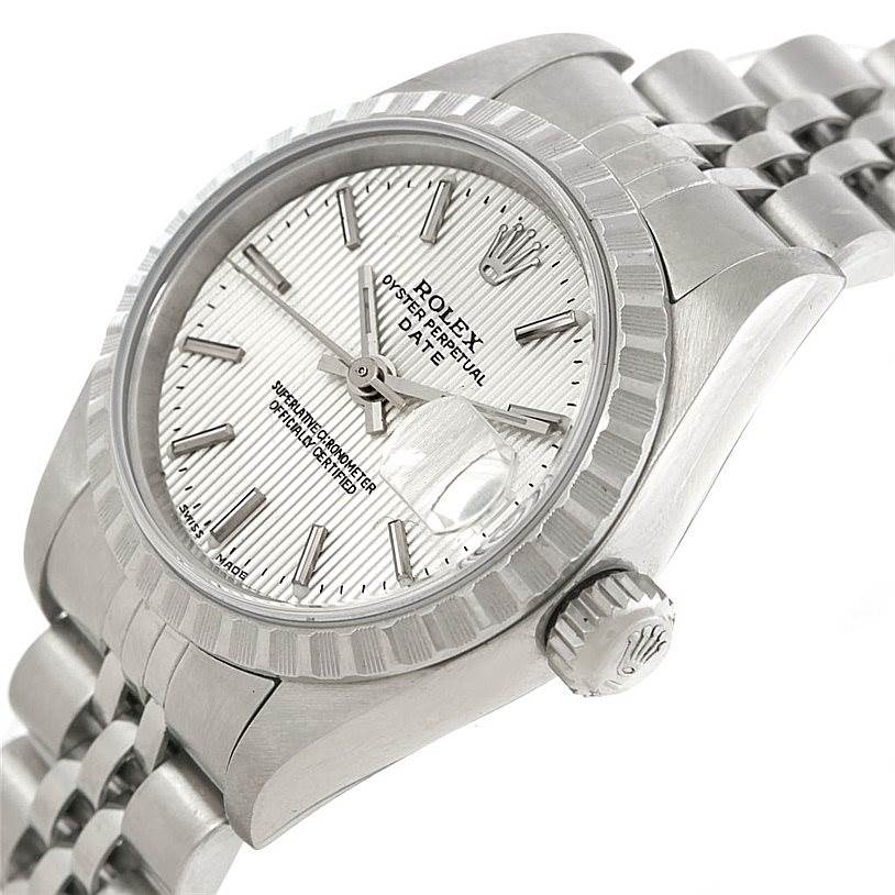 The image shows a Rolex Date 79240 Women's Stainless Steel Silver Dial 79240 Women's Stainless Steel Silver Dial model watch from a side angle, highlighting the dial, bezel, crown, and part of the bracelet.