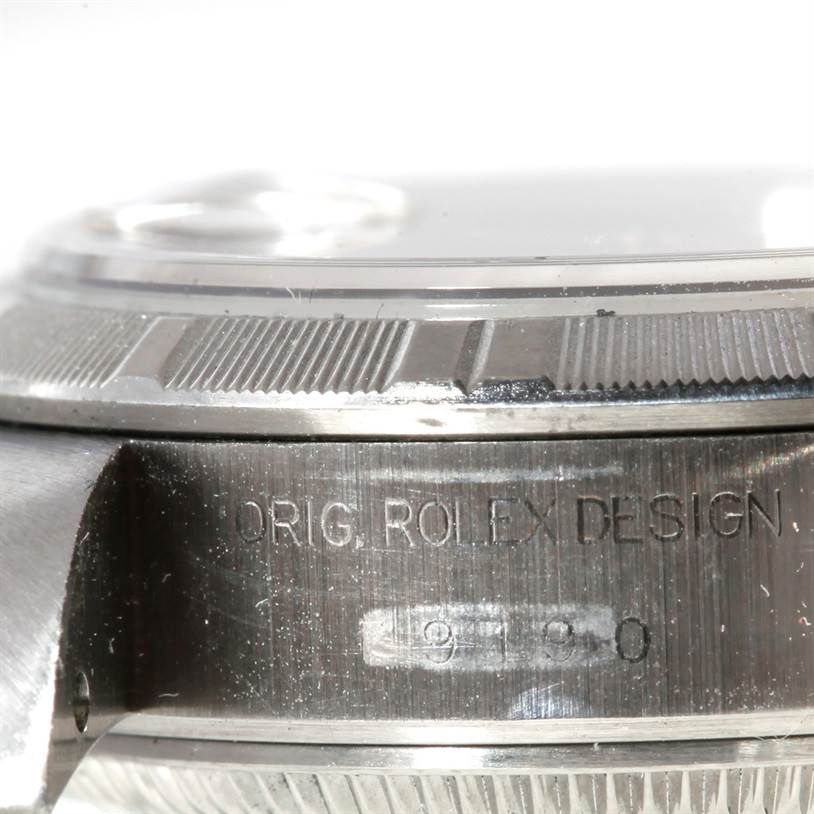 This close-up image shows the profile view of the bezel and part of the case with engravings of a Rolex Date 79190 Women's Stainless Steel Pink Dial 79190 Women's Stainless Steel Pink Dial model watch.