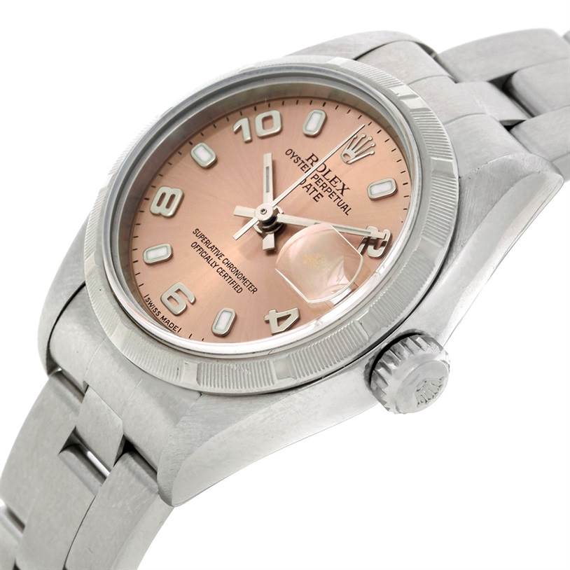 The image shows a Rolex Date 79190 Women's Stainless Steel Pink Dial 79190 Women's Stainless Steel Pink Dial model watch angled to display the face, crown, and part of the bracelet.