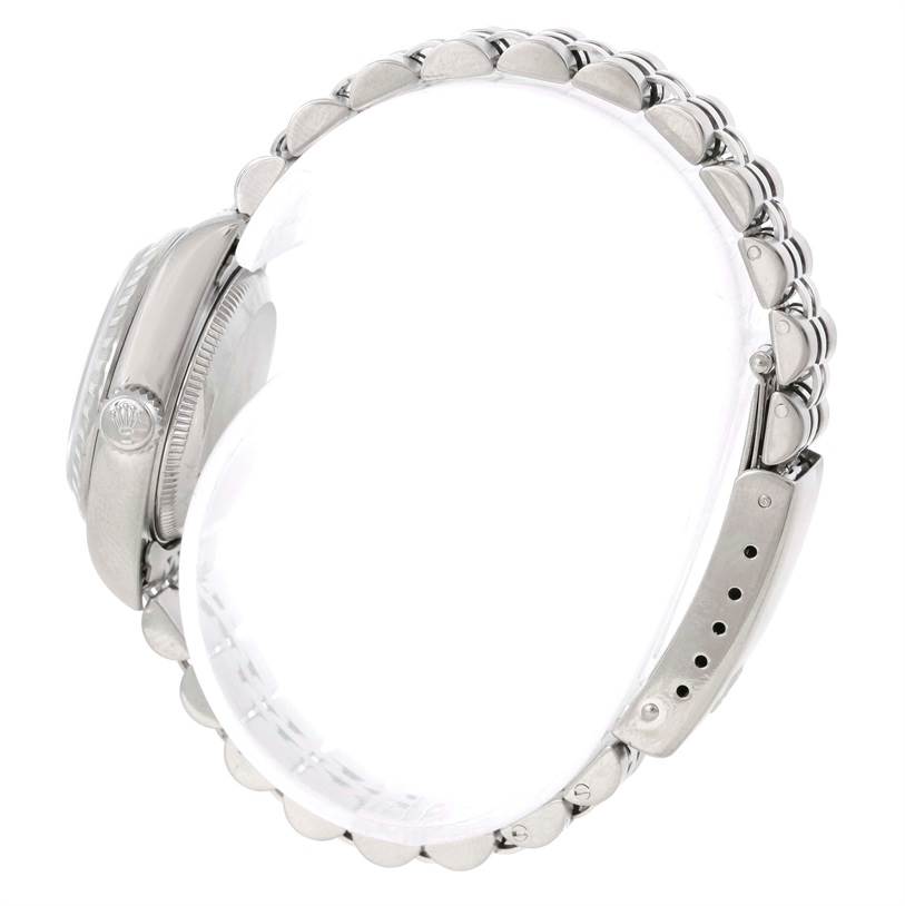 The image shows a side view of a Rolex Date 79240 Women's Stainless Steel White Dial 79240 Women's Stainless Steel White Dial model watch, featuring its bezel, crown, and bracelet.