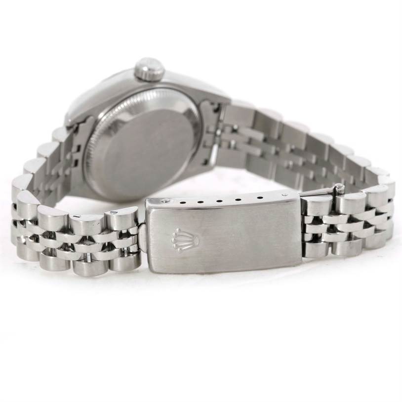 This image shows the reverse side of a Rolex Date 79240 Women's Stainless Steel White Dial 79240 Women's Stainless Steel White Dial model watch, highlighting the case back, bracelet, and clasp.