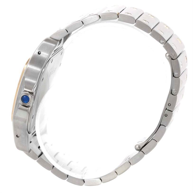 The image shows a side view of the Cartier Santos W20099C4 Men
s Stainless Steel Silver Dial W20099C4 Men
s Stainless Steel Silver Dial watch featuring its bracelet and blue cabochon crown.