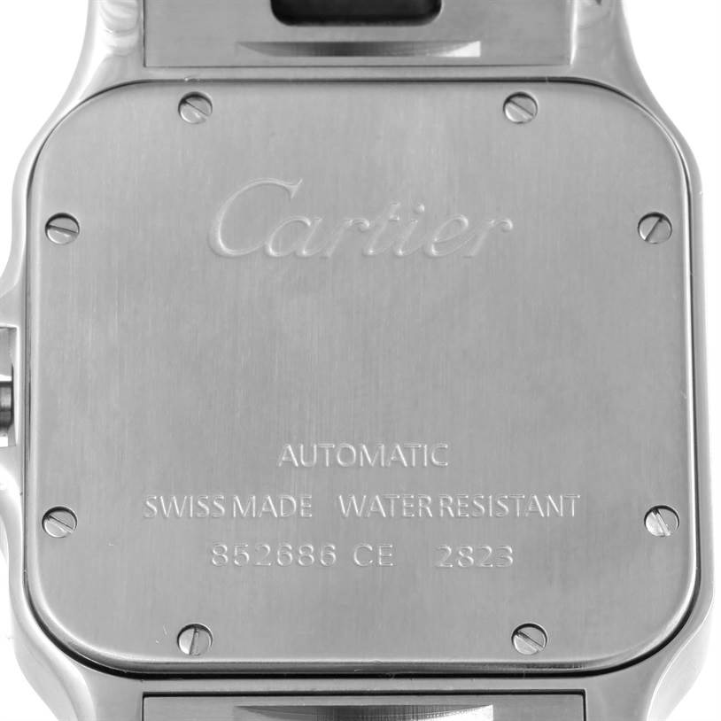 The image shows the back of a Cartier Santos W20099C4 Men
s Stainless Steel Silver Dial W20099C4 Men
s Stainless Steel Silver Dial watch, highlighting its markings and screws.