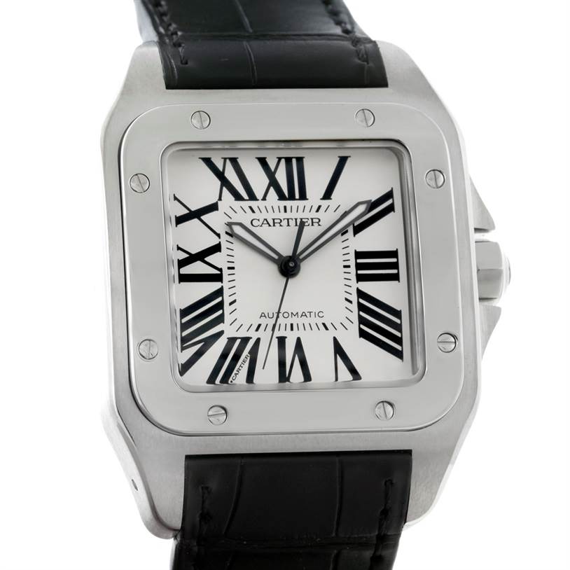 The image shows a straight-on view of the Cartier Santos W20073X8 Men's Stainless Steel Silver Dial W20073X8 Men's Stainless Steel Silver Dial watch, highlighting its face, Roman numeral dial, bezel, and part of the leather strap.
