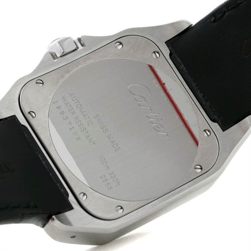 The image shows the case back of the Santos model by Cartier, along with part of the strap and the crown.