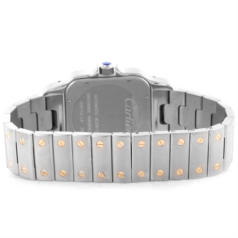 The image shows the back view of the Santos model wristwatch by Cartier, focusing on the bracelet and case back.