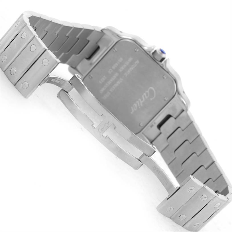 The image shows the backside of a Cartier Santos W20098D6 Men
s Stainless Steel Silver Dial W20098D6 Men
s Stainless Steel Silver Dial model watch, highlighting its clasp and stainless steel bracelet.
