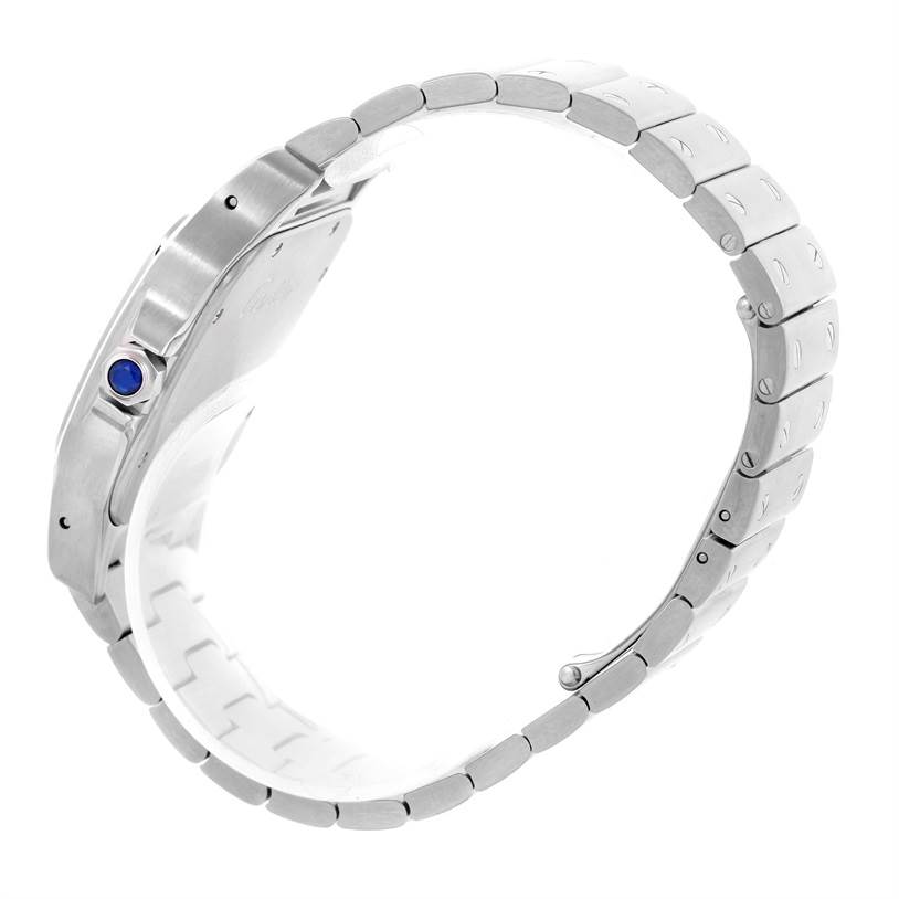 The image shows a side view of a Cartier Santos W20098D6 Men
s Stainless Steel Silver Dial W20098D6 Men
s Stainless Steel Silver Dial watch, highlighting its bracelet, case thickness, bezel, and the crown with a blue gem.