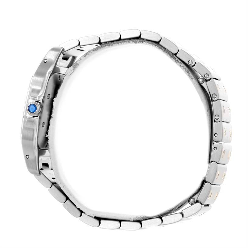 This side view of the Cartier Santos W20058C4 Men's Stainless Steel Silver Dial W20058C4 Men's Stainless Steel Silver Dial watch highlights its metal bracelet and crown, detailed with a blue stone.