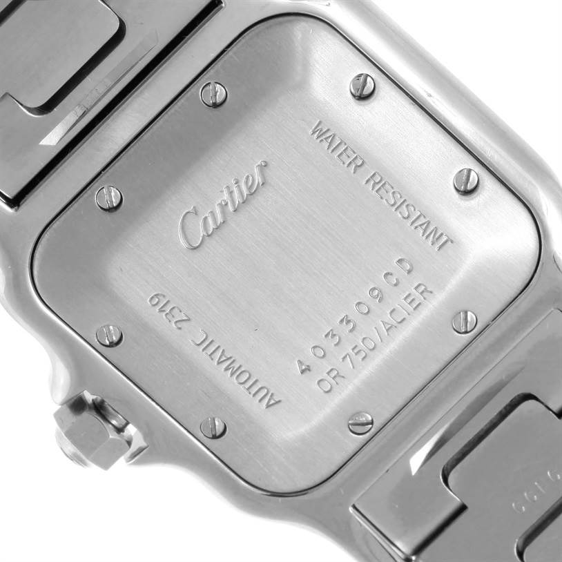 The image shows the back case of a Santos model by Cartier, highlighting the water resistance feature and markings.