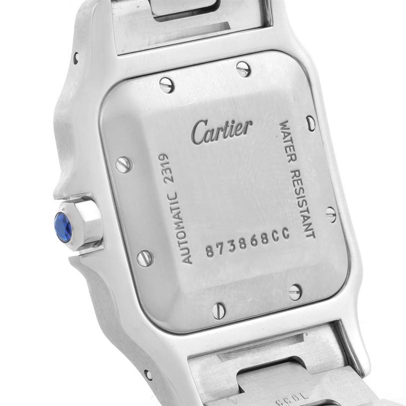 The image shows the back case of a Cartier Santos W20058C4 Men's Stainless Steel Silver Dial W20058C4 Men's Stainless Steel Silver Dial watch, highlighting the serial number and "Cartier" engraving.