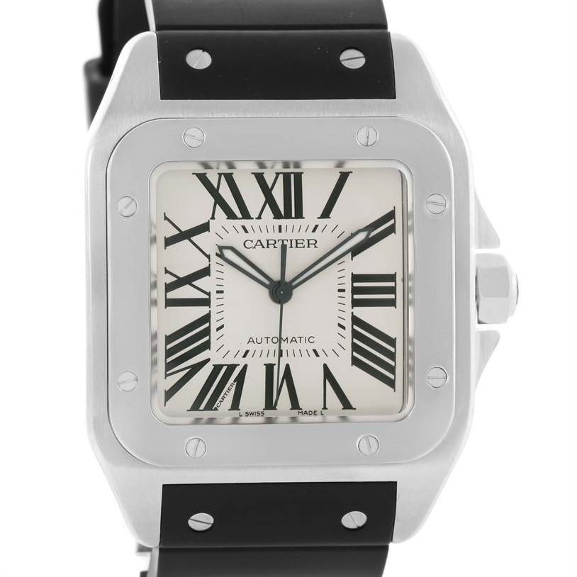 The image shows a front view of the dial and bezel of a Santos de Cartier watch, featuring its Roman numeral face and stainless steel case.