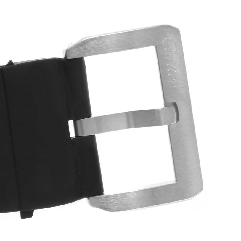 This image shows the stainless steel buckle of a Santos de Cartier watch, attached to a black strap, viewed from above.