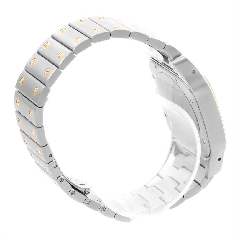 This image shows the bracelet and case back of the Santos model by Cartier from a side angle.