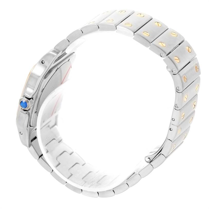 The image shows a side view of a Cartier Santos W20011C4 Men
s Stainless Steel Silver Dial W20011C4 Men
s Stainless Steel Silver Dial watch, highlighting its metal bracelet and blue cabochon crown.