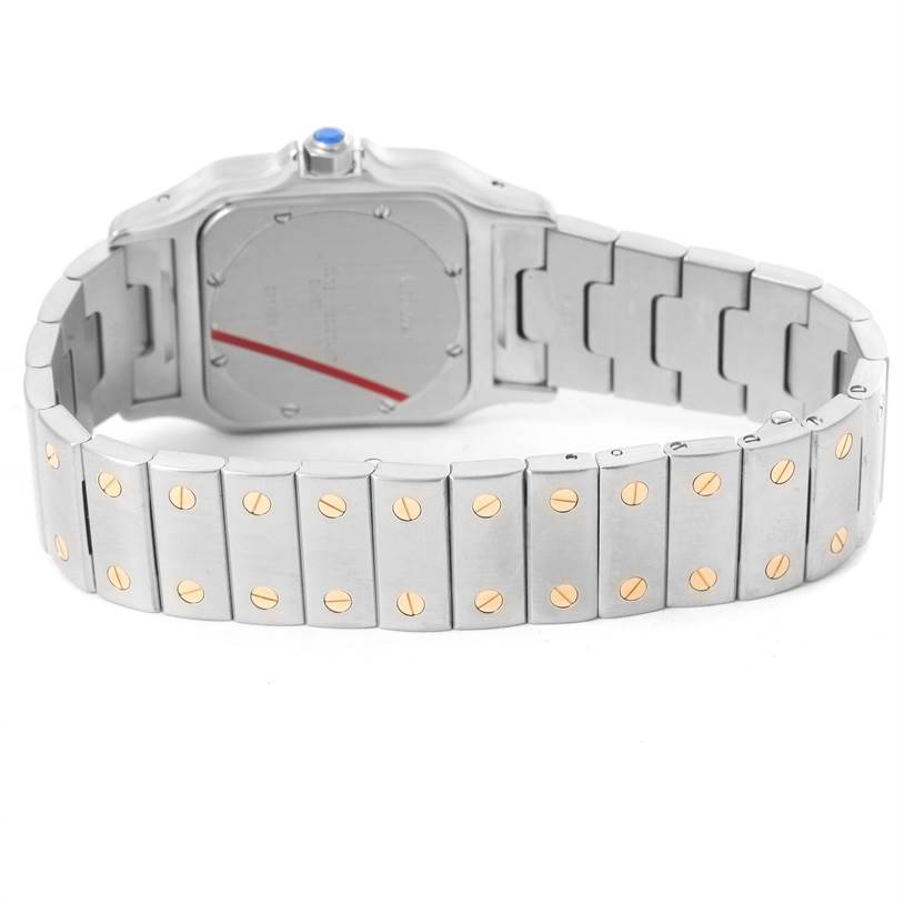 The image shows the back and bracelet of a Cartier Santos W20011C4 Men
s Stainless Steel Silver Dial W20011C4 Men
s Stainless Steel Silver Dial watch, highlighting its screws and deployment clasp.